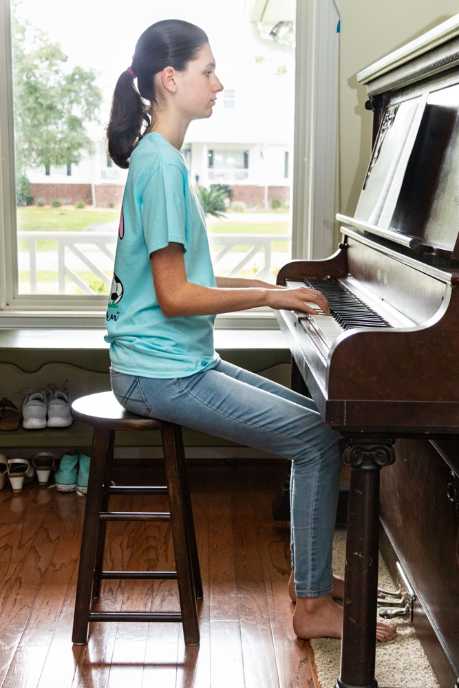 Good piano posture and hand position are crucial for two-handed playing